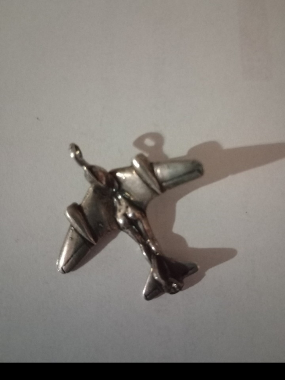 Silver female bodied plane pendant